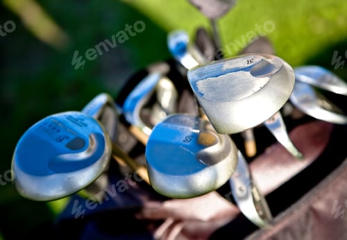 Preview: Abstract Golf Clubs With Green Grass In The Background