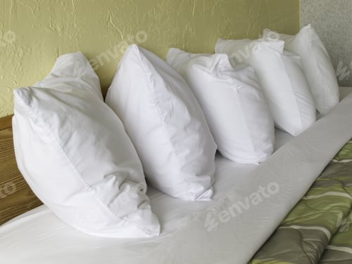 Preview: Row Of Five Pillows On Hotel Bed