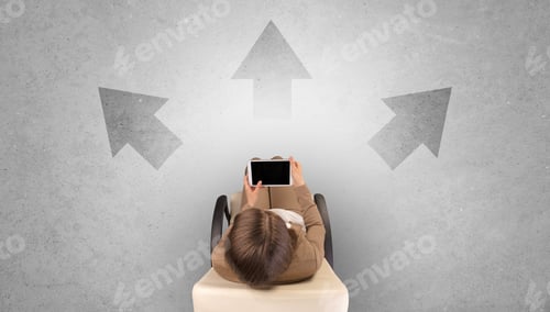 Preview: Woman Sitting In Office In A Beige Chair Using Device And Having To Choose Between Different Choices