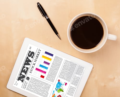 Preview: Workplace With Tablet Pc Showing Latest News And A Cup Of Coffee On A Wooden Work Table Close-Up