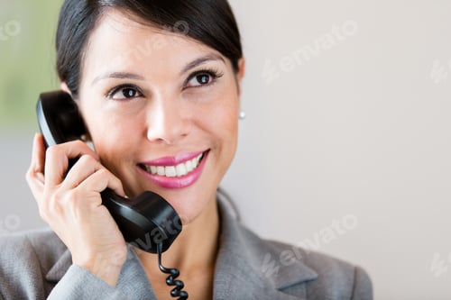 Preview: Successful Businesswoman Talking On The Phone And Smiling