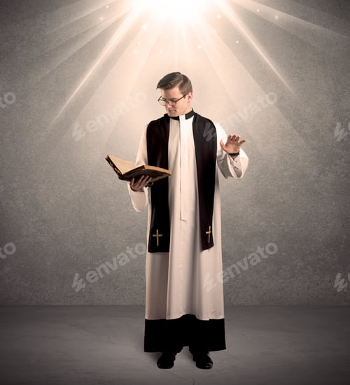 Preview: A Male Religious Young Priest In Black And White Dress Giving His Blessing, Holding The Holy Bible