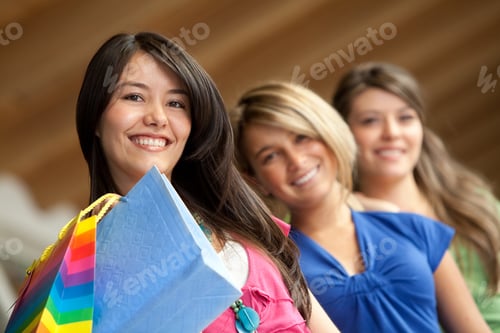 Preview: Shopping Women At The Mall Smiling With Bags