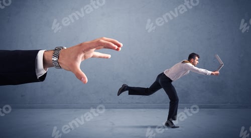 Preview: Young Miniature Businessman Running From A Big Hand With Blueish Background