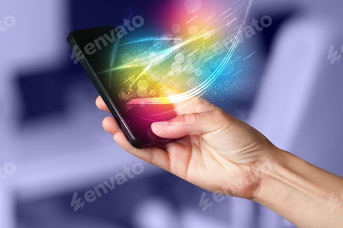 Preview: Hand Holding Smart Phone With Abstract Glowing Lines Concept