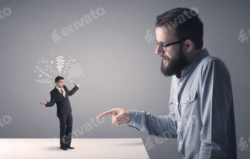 Preview: Young Professional Businessman Being Angry With An Other Miniature Businessman Who Has Scribbles