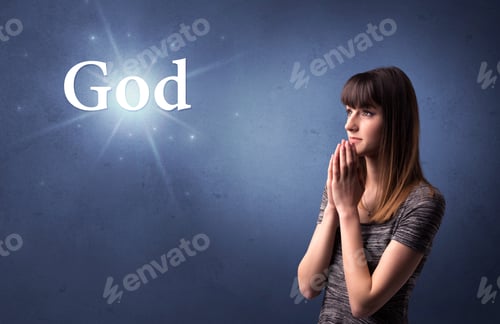 Preview: Young Woman Praying On A Blue Background With The Word God Written Above Her