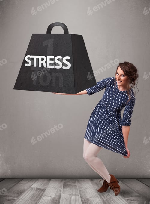 Preview: Attractive Young Woman Holding One Ton Of Stress Weight