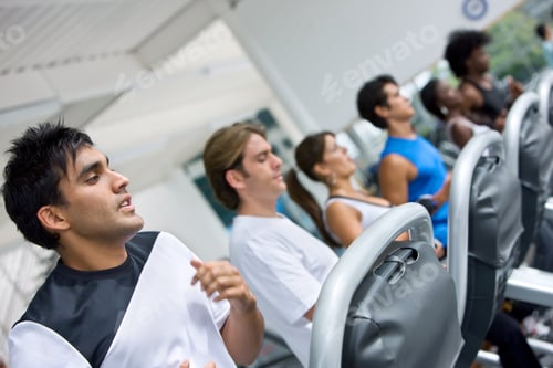 Preview: Group Of People At The Gym Doing Exercise On The Machines
