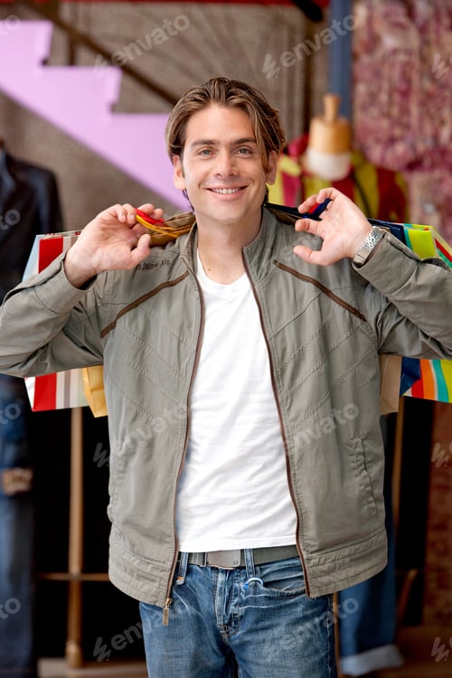 Preview: Male Shopper Holding Some Paper Bags At A Retail Store