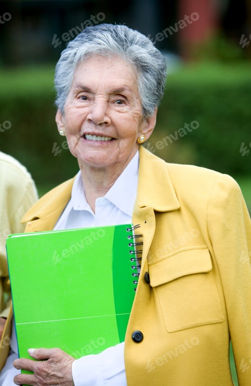 Preview: Beautiful Elder Woman With A Notebook Outdoors