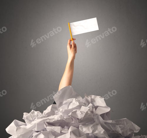 Preview: Female Hand Emerging From Crumpled Paper Pile Holding A White Blank Flag