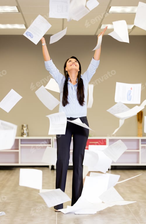 Preview: Successful Businesswoman Throwing Papers In The Air