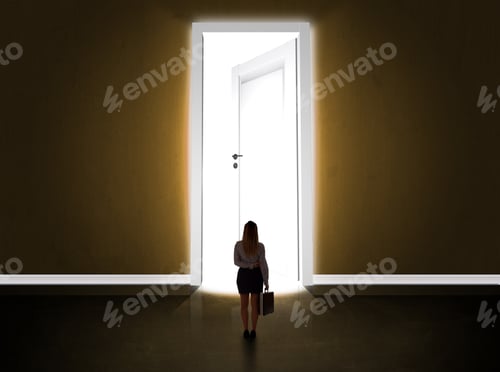 Preview: Business Woman Looking At Big Bright Opened Door Concept