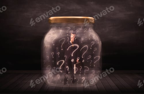 Preview: Businessman Locked Into A Jar With Question Marks Concept On Background