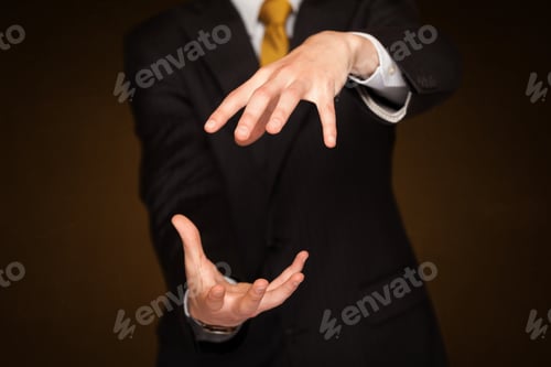 Preview: Businessman Holding Something In Front Of His Body