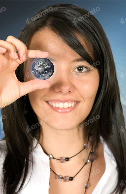 Preview: Business Woman Holding A Globe Over A Dark Background