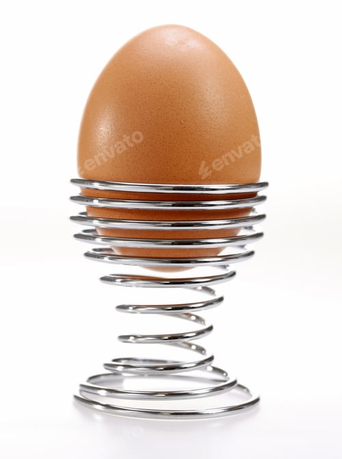 Preview: Egg In Cup On White Background
