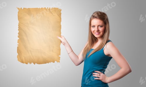 Preview: Beautiful Young Girl Presenting Old Paper Copy Space