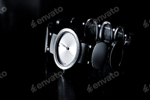 Preview: Elegant Silver Watch on a Dark Reflective Surface