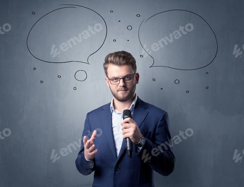 Preview: Businessman Speaking Into Microphone With Speech Bubbles Over His Head