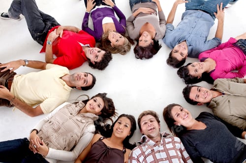Preview: Large Group Of People With Their Heads Together On The Floor
