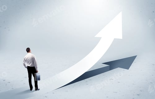 Preview: A Young Adult Salesman Standing In Front Of A Big Arrow Pointing Up With A Shadow In Grey Empty