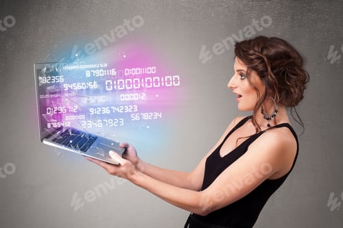 Preview: Attractive Casual Woman Holding Laptop With Exploding Data And Numers
