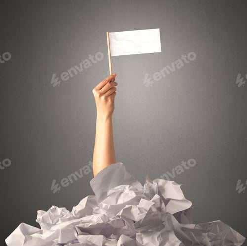 Preview: Female Hand Emerging From Crumpled Paper Pile Holding A White Blank Flag