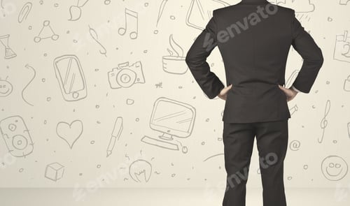 Preview: Businessman From The Back In Front Of An Social Media Icon Wall