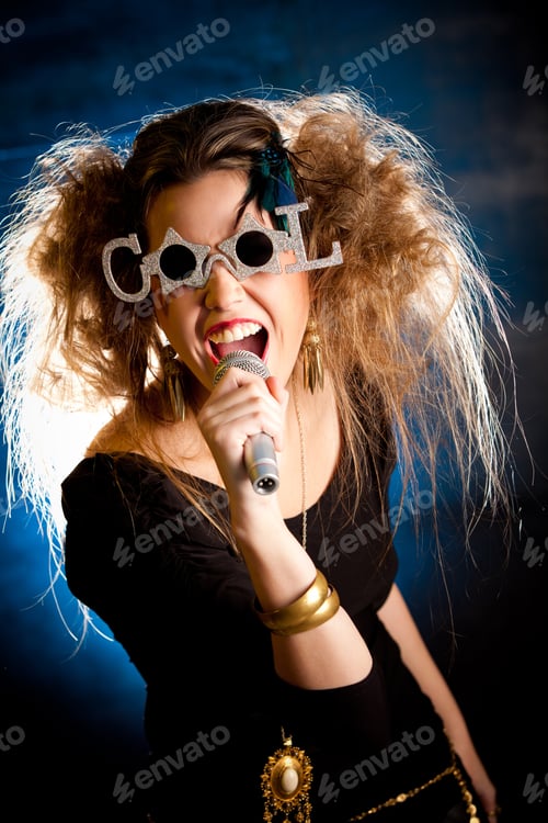 Preview: Rocker Woman With Messy Hairdo Singing With A Microphone