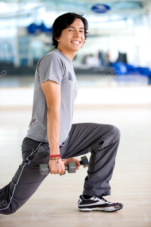 Preview: Man Lifting Free Weights At The Gym