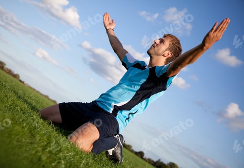 Preview: Football Player Celebrating With Arms Open Outdoors