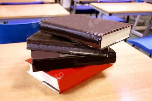 Preview: Books On A Desk At A Library