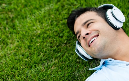 Preview: Man Listening To Music Outdoors With Headphones