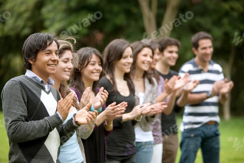 Preview: Group Of People Applauding And Smiling Outdoors