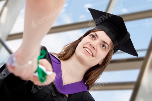 Preview: Female Grad Student Getting Her Diploma And Smiling
