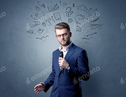 Preview: Businessman Speaking Into Microphone With Mixed Doodles Over His Head