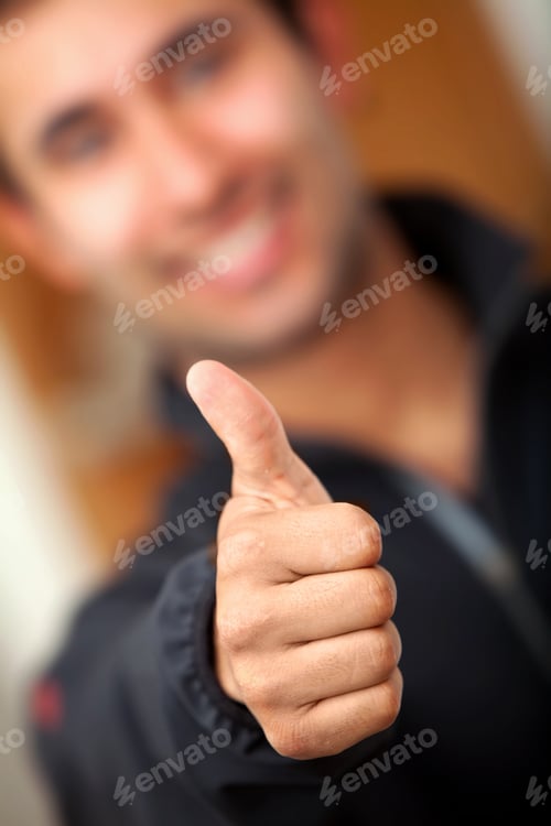 Preview: Guy With Thumbs Up Focus On Hand Indoors
