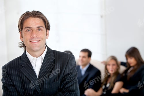 Preview: Handsome Business Man Smiling In An Office
