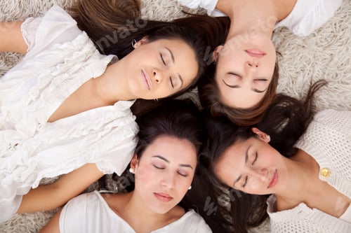 Preview: Group Of Women Lying On The Floor With Eyes Closed