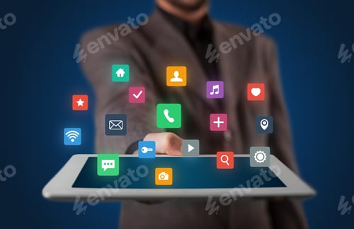 Preview: Businessman Holding Tablet With Colorful Applications