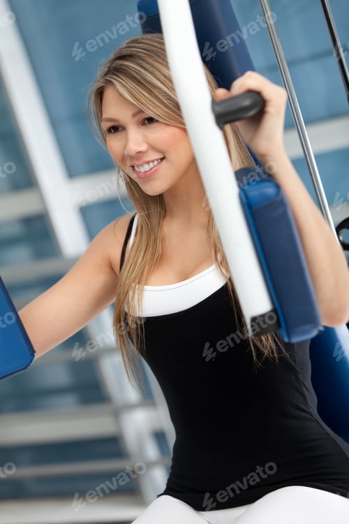 Preview: Woman At The Gym Exercising On A Machine