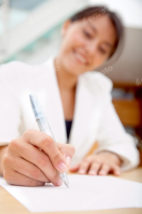 Preview: Business Woman Signing A Contract At The Office