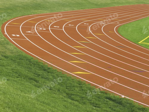 Preview: Tilted View Of Curve In Eight-Lane Track For Collegiate Runners