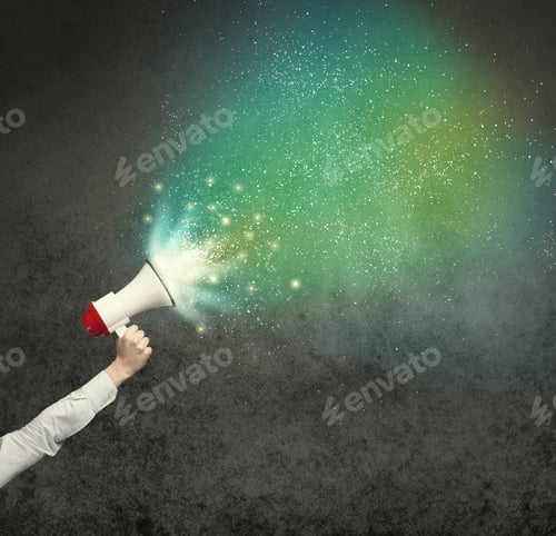 Preview: Caucasian Business Hand Holding Megaphone With White Sparkles On A Grunge Background