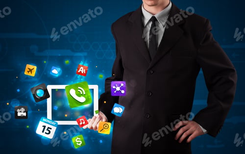 Preview: Young Businessman Holding A Tablet With Modern Colorful Apps And Icons
