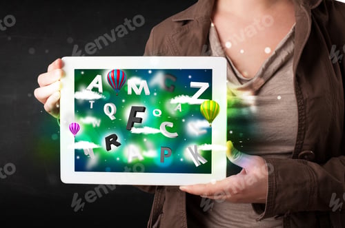 Preview: Young Person Showing White Tablet With Abstract Letters And Sky