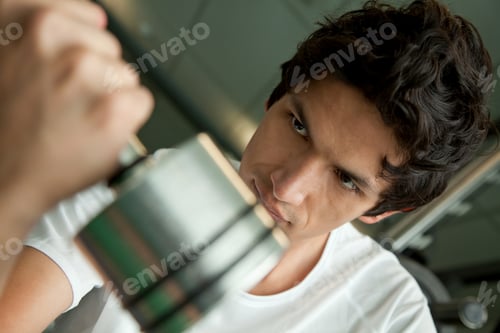 Preview: Handsome Man Lifting Free Weights At The Gym