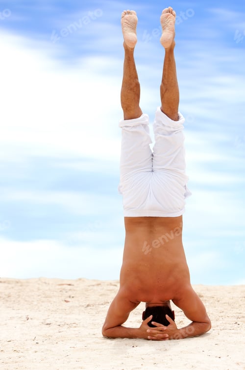 Preview: Fullbody Man Doing Yoga On The Beach